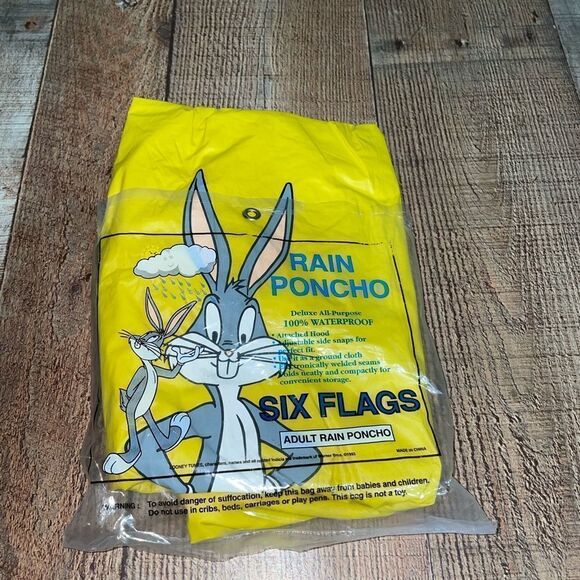 VTG 90’s 1993  Six Flags Bugs Bunny Rain Poncho Yellow Vinyl Adult Size - Picture 1 of 3